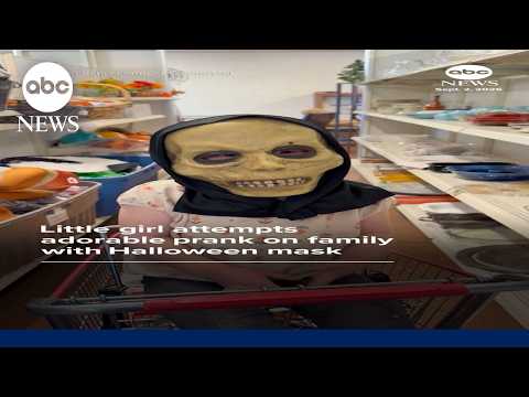 Little girl attempts adorable prank on family with Halloween mask