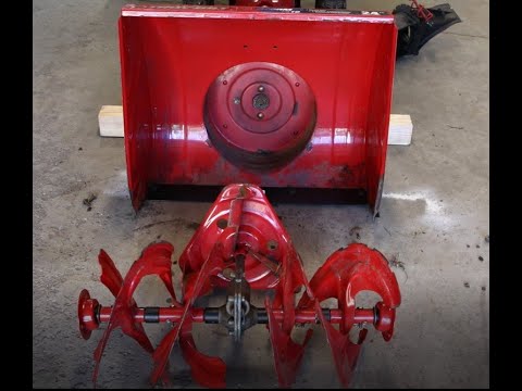 Troy Bilt Snow Blower Repair, Auger removal with bushings and spacers replaced and reassembled.