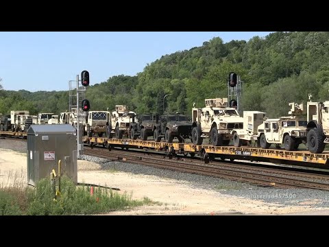 Military Train loaded with tanks, artillery, and other equipment on the BNSF Railway -Drone views-