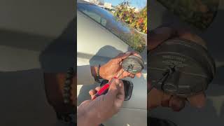 How to remove a locked Gas Cap without a key .