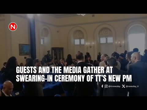Guests and the media gather at swearing in ceremony of TT's new PM