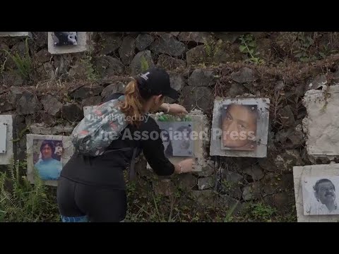Relatives of Colombia's disappeared watch on as excavators sift through soil in Medellin, searching
