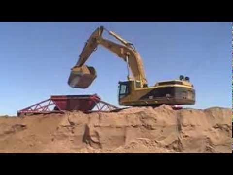 Cat 375 and 385 loading trucks