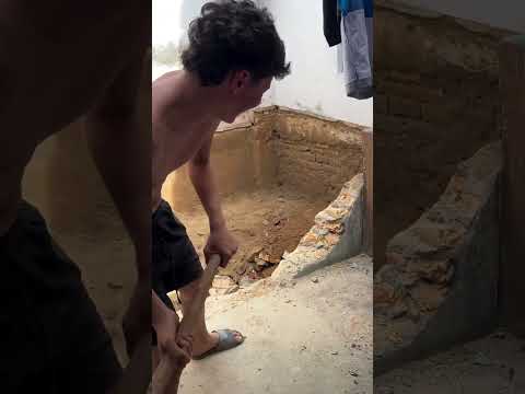 Man loses balance while using sledgehammer during demolition in Tangara, Rio Grande do Norte, Brazil