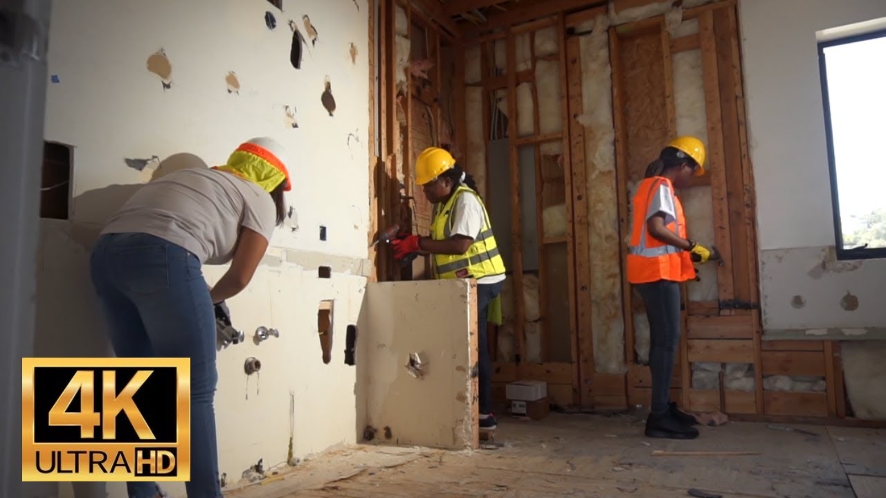 Royalty Free 4K Stock Footage | Free Download | Construction Workers Renovating A Home