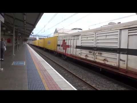 QR LDP 005 with Aurizon 6004 Freighter passing Hornsby southbound
