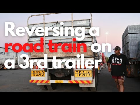 Reversing a road train on to a thrid trailer