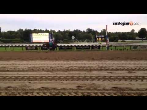 Stopchargingmaria wins the Alabama Stakes. Owner Mike Repole and wife Maria lead the filly into the