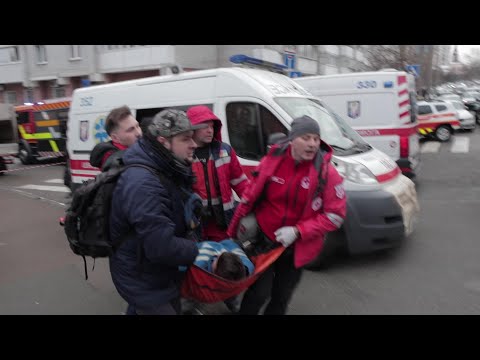 Kyiv emergency workers respond after missile strikes | AFP
