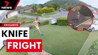 Police use a cherry picker to force a knife-wielding man off a Keperra home roof  | 7 News Australia