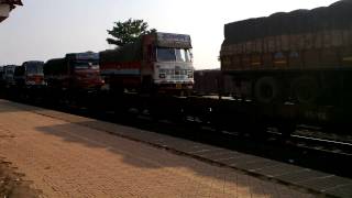 preview picture of video 'Konkan Railway Train Carrying Tranport Trucks @ Kudal Raliway Station'
