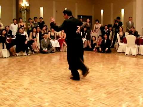  Fabian Peralta  and  Virginia Pandolfi  are  dancing  to  the  tango  "  Sinsabor  "