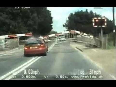 Amazing high-speed police chase as car smashes through level crossing barrier