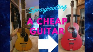 Spray painting a cheap acoustic guitar.