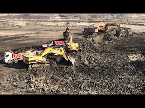 Three Caterpillar 365C Excavators Loading Trucks