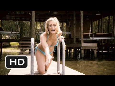 Trailer still: wakeboarding across the lake as a fin knifes the surface behind