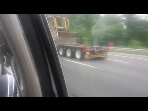 Kenworth W900L hauling a CAT D7R bulldozer