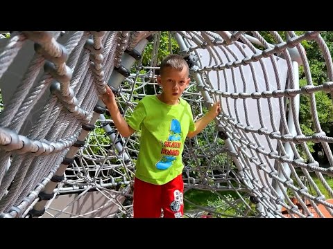 Sofia and Max have fun with Dad at the new playground