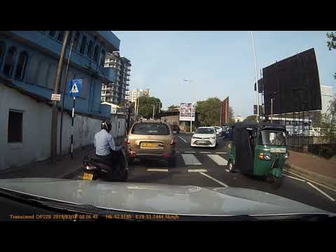 Sri Lankan motorists not stopping for kids at a pedestrian crossing