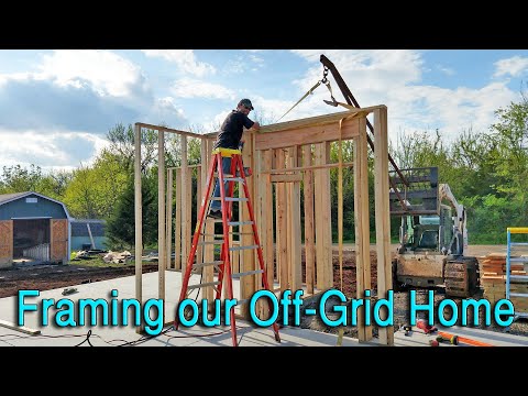 Framing Our Off-Grid Home Finally Begins with the help of an S175 Bobcat Skid Steer Crane Attachment