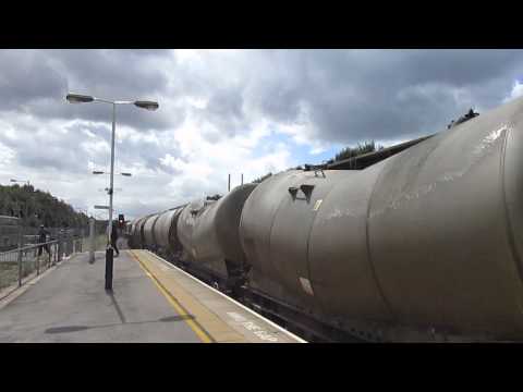 Freightliner class 66557 hauls cement tanks through Chesterfield 12/8/14