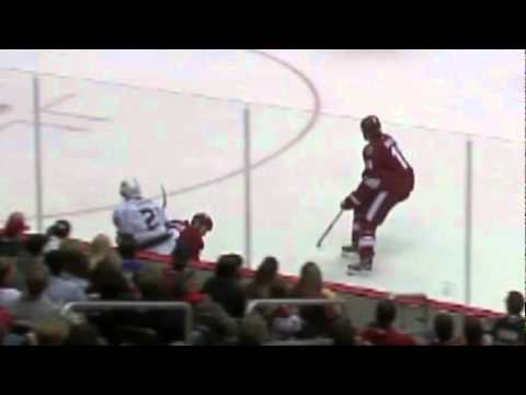 Derek Morris hipchecks Scott Parse