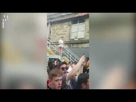 Man casually reads a book during a rave
