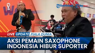 Momen Piala Dunia 2022 Qatar, Orang Indonesia Bermain Saxophone Mengenakan Pakaian Tradisional Jawa