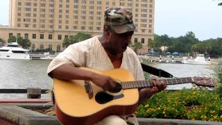 Walter Harris singing Louis Armstrong's "What A Wonderful World" on River Street.