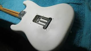 Repainting a Fender stratocaster.