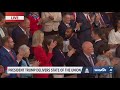 Rep. Al Green escorted out of State of the Union, holds sign