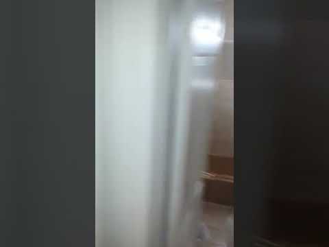 My friend E showing the inside of the Amityville Horror House on moving day