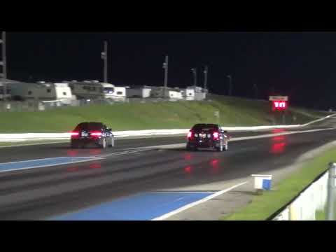 2004 Cadillac CTS-V LS6/T56 vs. E92 BMW 335i X-drive Drag Race