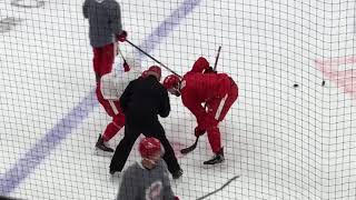 Red Wings’ Michael Rasmussen works with Luke Glendening on face-offs.