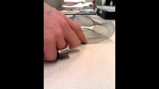 Actuated knit textile containing shape memory alloys (SMAs)