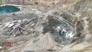 Shooting down to the floor within 200 feet from the crusher. We used 93 holes and one blast crew.