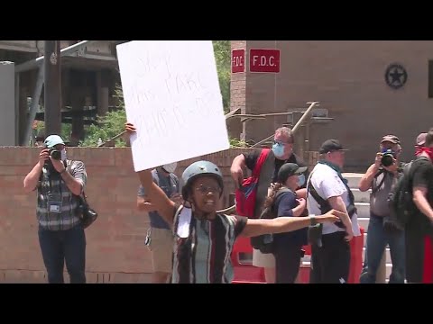 Austin officers take a knee in solidarity with protesters against police brutality