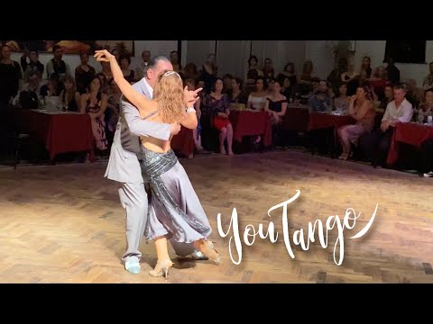  Lorena Ermocida  and  Oscar Martinez Pey  are  dancing  to  the  tango  "  La Yumba  "  by  Orquesta Escuela de Tango  in  2020