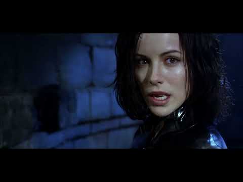 Trailer frame: Selene and Michael framed against cold dawn light as score softens