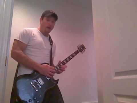Me in a Doorway with my Gigson SG guitar on my Frenzel 5E3 amp