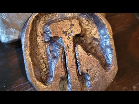Casting a bronze homemade emblem out of wax.