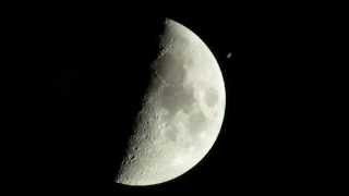 The International Space Station (ISS) crosses (transit) the moon