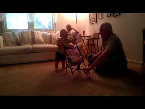 Adam pushing a stroller.