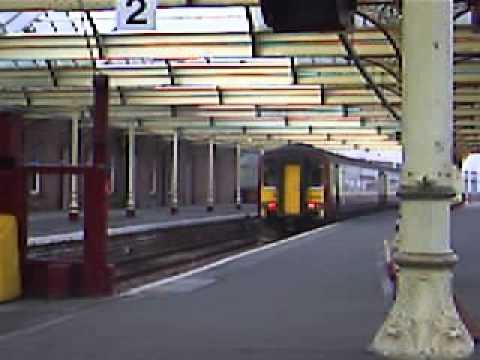 a Train Departs Kilmarnock  for Glasgow
