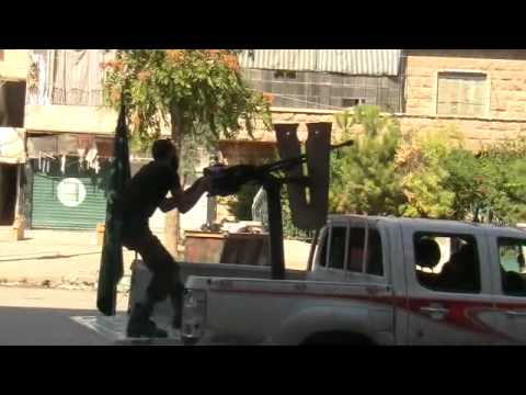 التصدي للطيران الحربي بواسطة رشاش دوشكا في بستان القصر في حلب من قبل لواء درع الشهباء