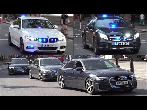 Big video of unmarked police cars and emergency vehicles responding with siren and lights