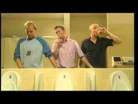 three guys helping each other piss one smoking one drinking