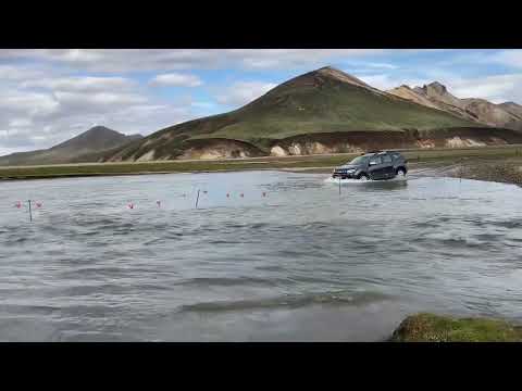 Beautiful Iceland: car crossing river at landmannalaugar / Dacia Duster