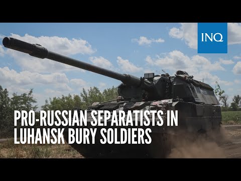 Pro-Russian separatists in Luhansk bury soldiers