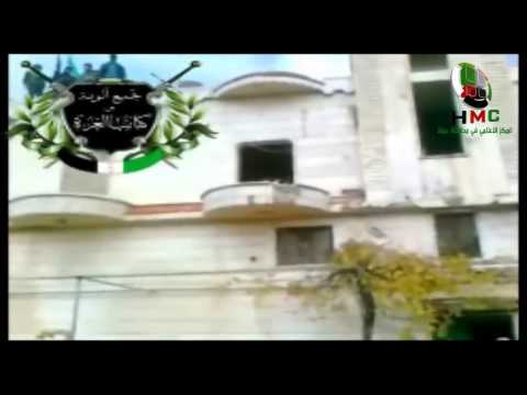 مقاتلوا تجمع ألوية وكتائب العزة داخل حاجز أبو شفيق في منطقة مورك في ريف حماة بعد السيطرة عليه